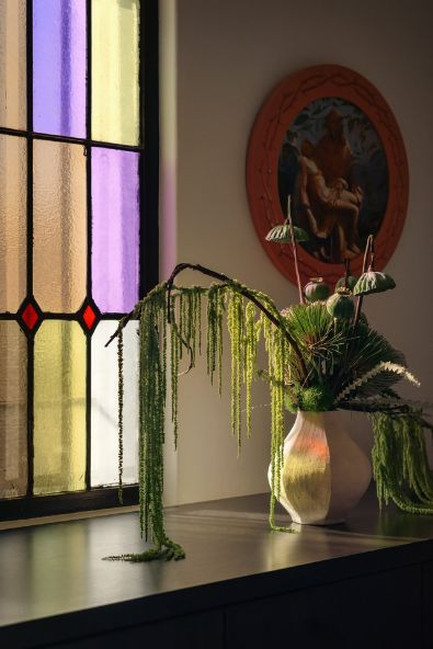 Stained glass and flowers at Hotel Lucile